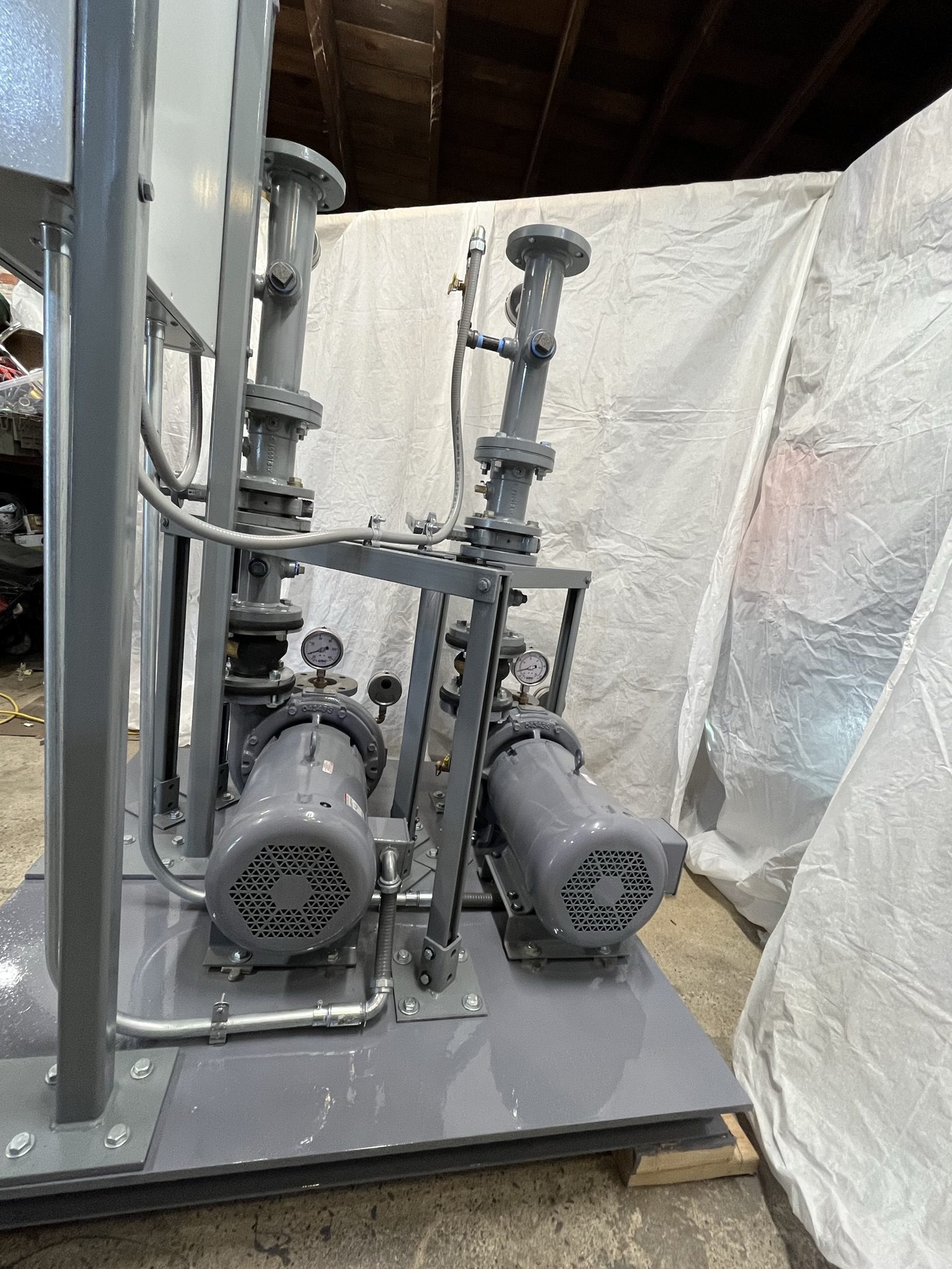 Twin pump motors, gauges, and discharge piping
